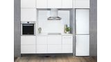 White refrigerator in small space kitchen