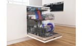 Full Bosch PerfectDry dishwasher with door open and three racks pulled out.