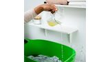 Pouring lime juice onto clothes
