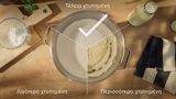 Ένα μπολ με σαντιγί τραβηγμένο από πάνω με τρία τμήματα που δείχνουν 1 τέλειο αποτέλεσμα και 2 κακά αποτελέσματος χτυπήματος, διαχωρισμένα με γραμμές: στο επάνω τμήμα υπάρχει ένα τικ και η λεζάντα «perfect» (τέλειο). Στο αριστερό τμήμα υπάρχει η λεζάντα «under-whipped» (ανεπαρκές χτύπημα), στο δεξί τμήμα η λεζάντα «over-whipped» (υπερβολικό χτύπημα).