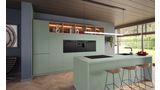 Groene keuken met keukentoestellen van de Bosch Matt Design-lijn.