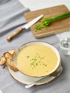 An Austrian favourite: thickened semolina soup with hints of nutmeg and sweet cream, topped with chives.