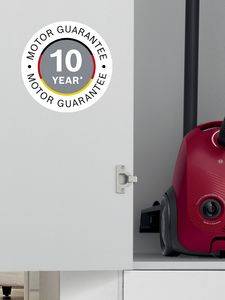 A bagged Bosch vacuum cleaner in a cupboard
