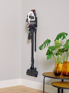 Unlimited vacuum cleaner hanging on wall