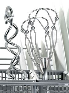 Hand mixer attachments in the dishwasher basket.