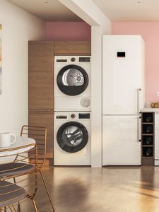 Stacked Bosch dryer and washer with a convenient pull-out shelf for laundry.