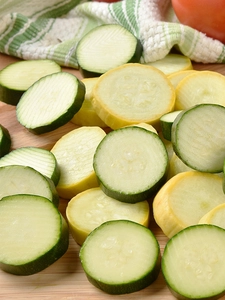 Slices of zucchini and pattypan squashes.