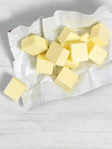 Cubes of butter on a foil wrapper. 