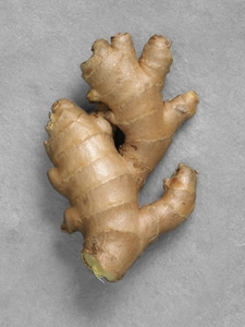 A piece of fresh ginger root.