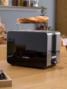 Sky toaster on a kitchen top in black.