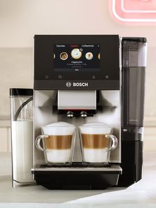 Series 8 coffee machine with two cappuccinos demonstrating two-cup function and integrated milk container.
