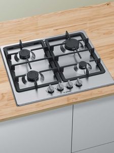 Gas hob on wooden countertop