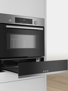 Bosch warming drawer open, under a built in oven