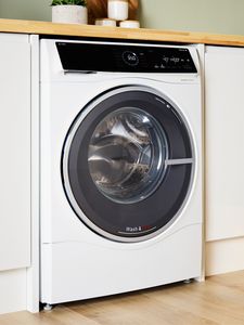 Bosch washer dryer under a kitchen counter