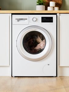 Bosch washing machine under a kitchen counter