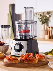 Bosch kitchen machine on countertop surrounded by different food