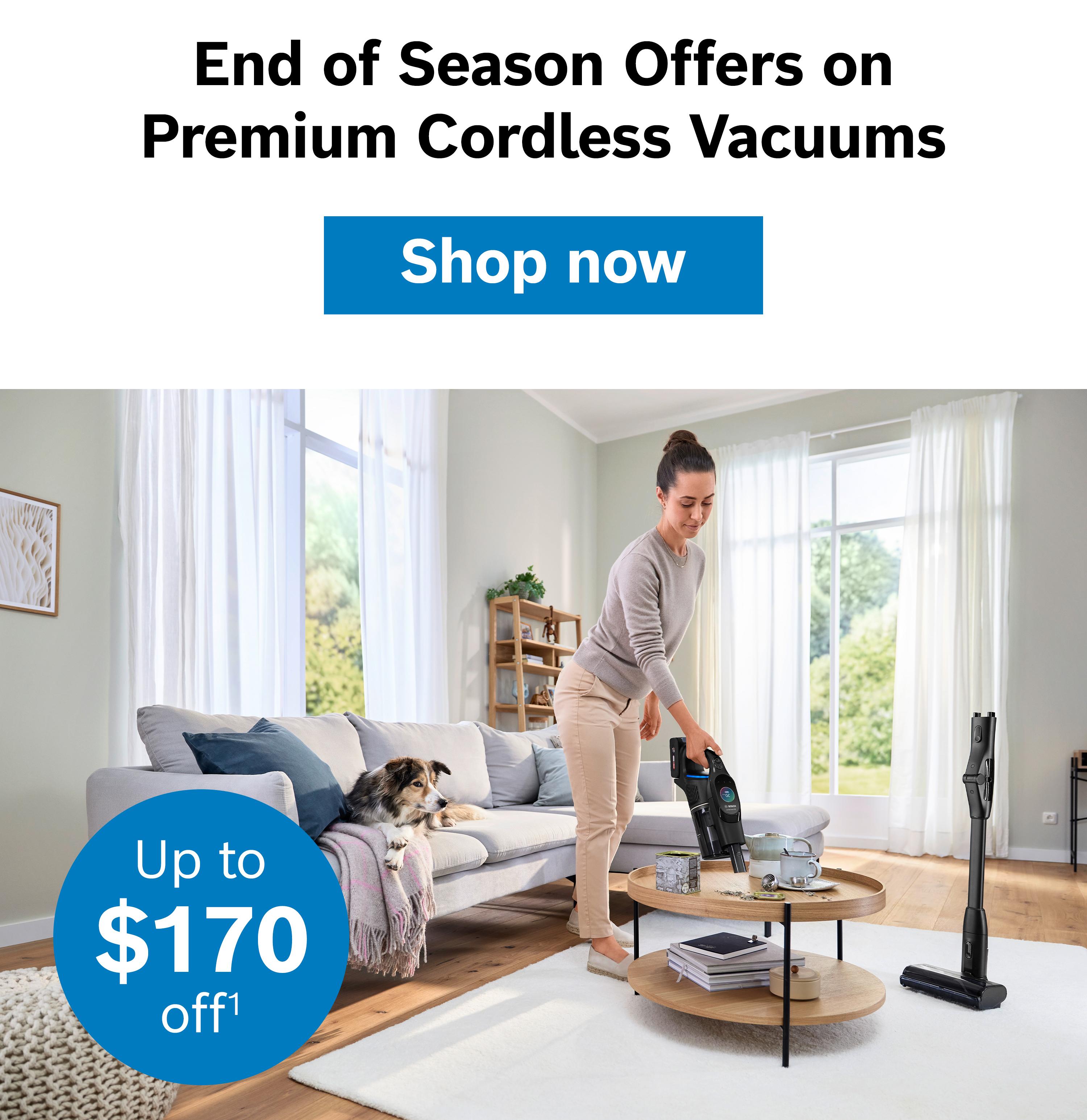 Woman using a cordless vacuum with promotion for discounts up to $170 in a bright living room.