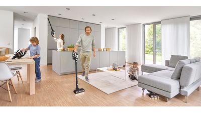Multiple people using Unlimited vacuum cleaners in different ways and areas of living space