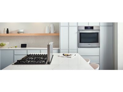 An oven and microwave in a modern living environment.