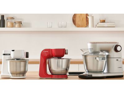 Line up of the three MUM stand mixers on a kitchen worktop.