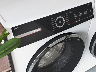 Kaktus v obliki glave in roka, ki sega proti predalu za detergent i-DOS pralnega stroja Bosch