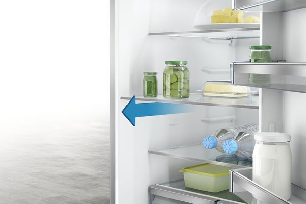 Close up of Bosch fridge interior. Arrow show how to remove shelves for cleaning.