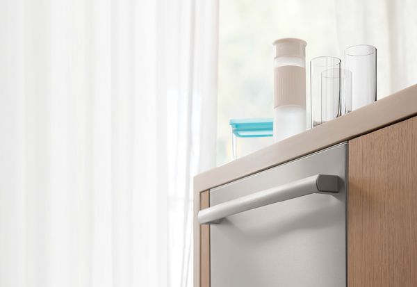 Bosch dishwasher with clean dishes on the counter