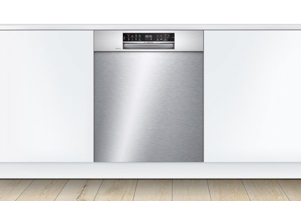 Underbench dishwasher stainless steel finish in a modern white kitchen.