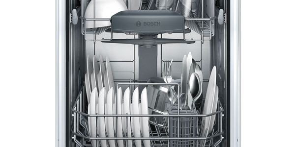 Dishwasher door with front control opening to reveal a top rack with larger items like saucers and a wine glass