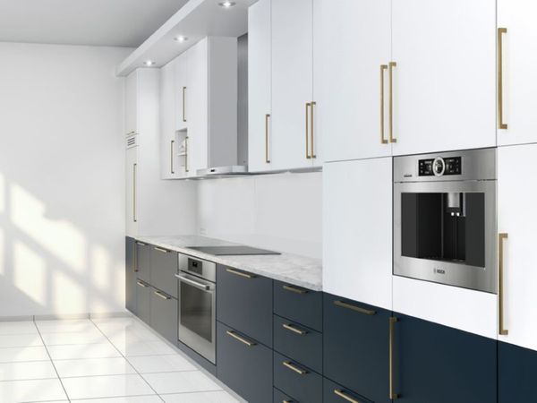 nterior view of a built-in coffee machine installed in white cabinetry