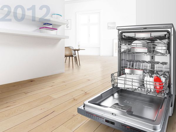 Open dishwasher showing sparkling ceramic and plastic dishware.