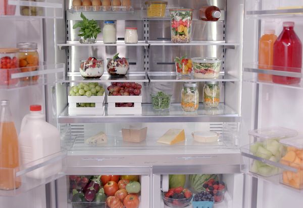 open refrigerator with food on shelves