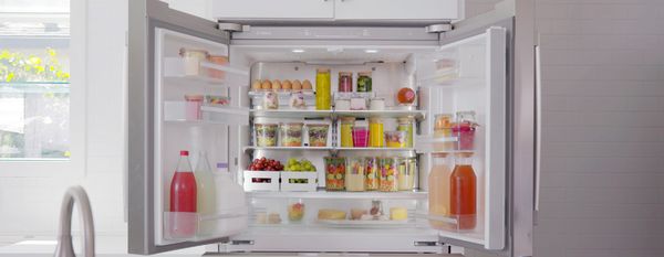 Bosch refrigerator open doors with food and drinks