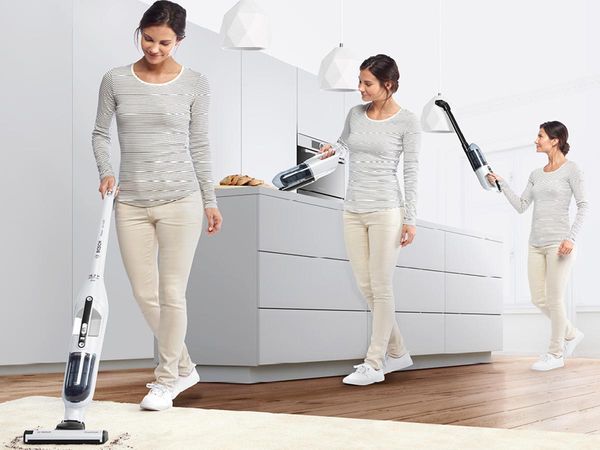 A woman is shown vacuuming in three different positions.