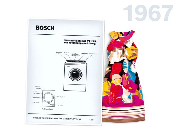 Owner's manual for a washer-drawer placed next to a colourful short sleeveless dress.