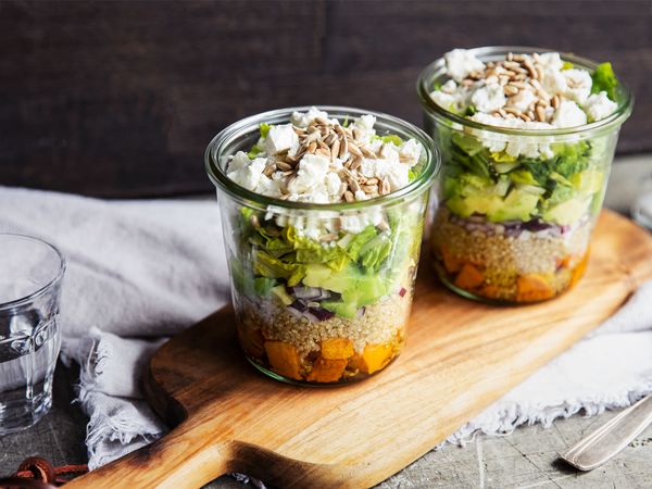 Layered Quinoa Salad with Sweet Potato and Feta Cheese in cute glass jars