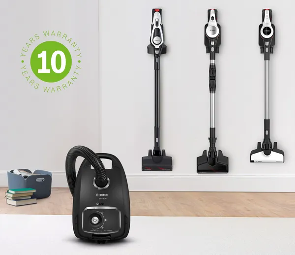 Black Bosch vacuum cleaner on a white rug. To the left, the 10 year warranty icon stands for the free extended motor warranty.
