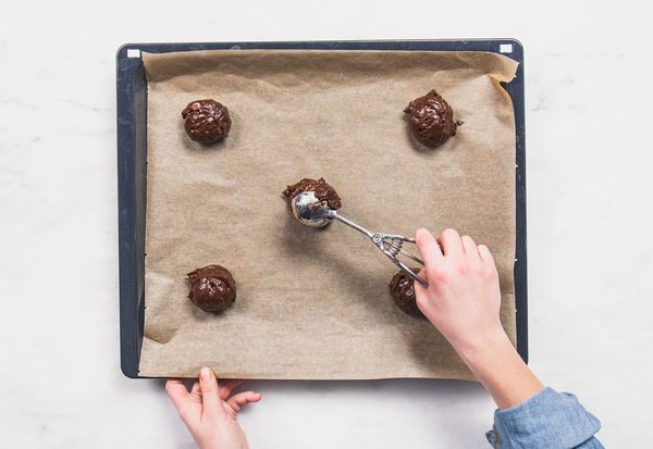 Adding brownie mix to a baking sheet