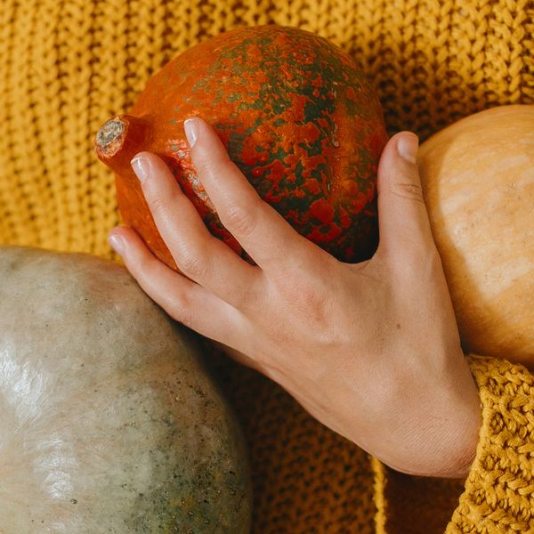 Person holding multiple gourds