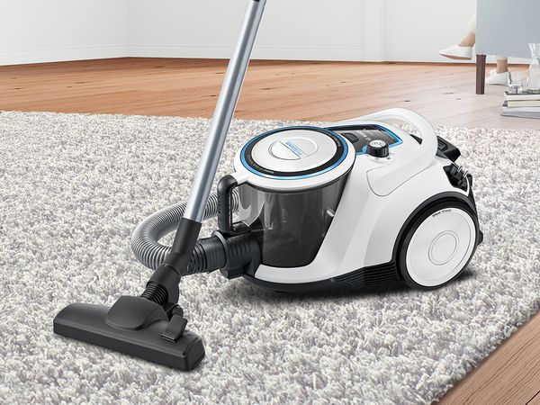 White ProSilence vacuum on a fluffy living room rug