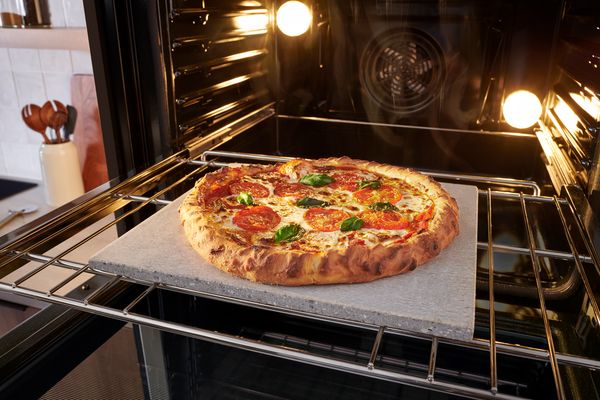 Bosch wall oven cooking a pizza