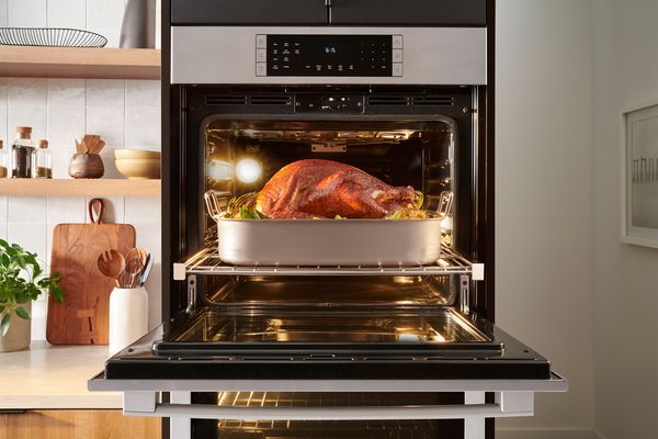 Wall oven baking a full turkey