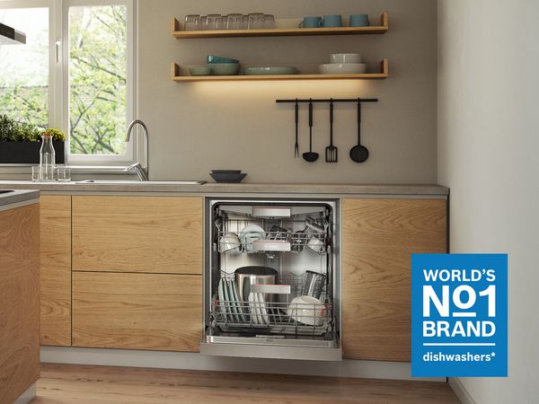 Bosch dishwasher in a modern kitchen with dining table in the background and Brand No.1 logo. 