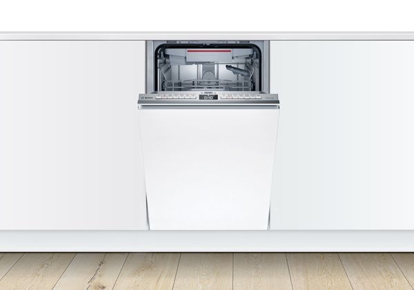 Fully integrated slimline dishwasher from Bosch with door slightly ajar.