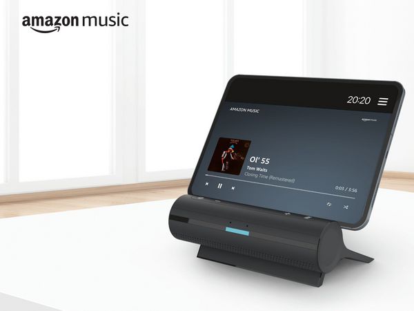 Tablet sat in smart dock on kitchen countertop with Amazon Music on screen