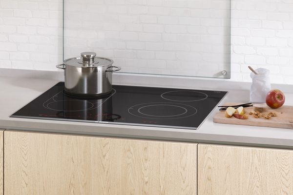 An electric hob with one pot.