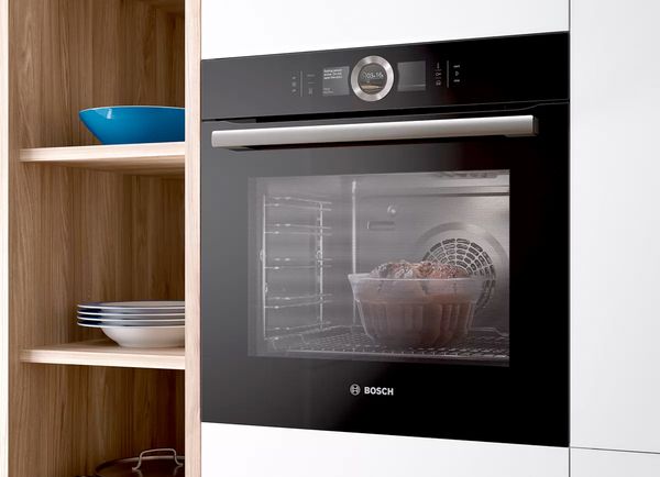 A Bosch convection oven with a cake baking inside.