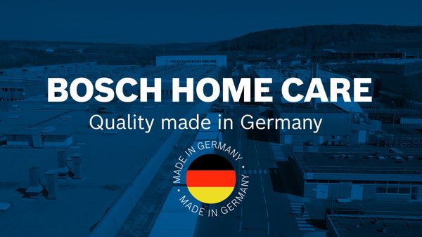 En blå startskärm visar industrilokaler med videotiteln "Bosch home care" över den.