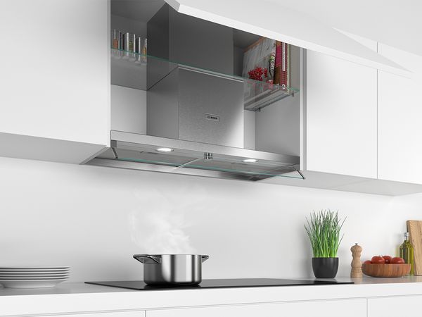 An integrated cooker hood with extra storage space on the sides.