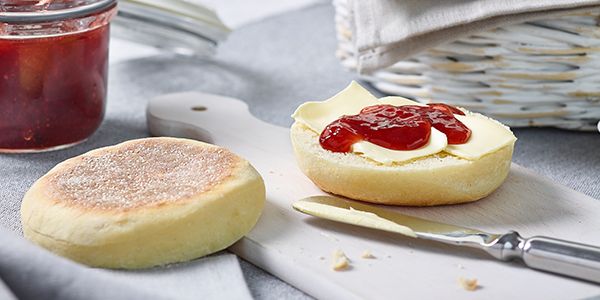 Fresh-based English muffins with butter and homemade strawberry jam.  